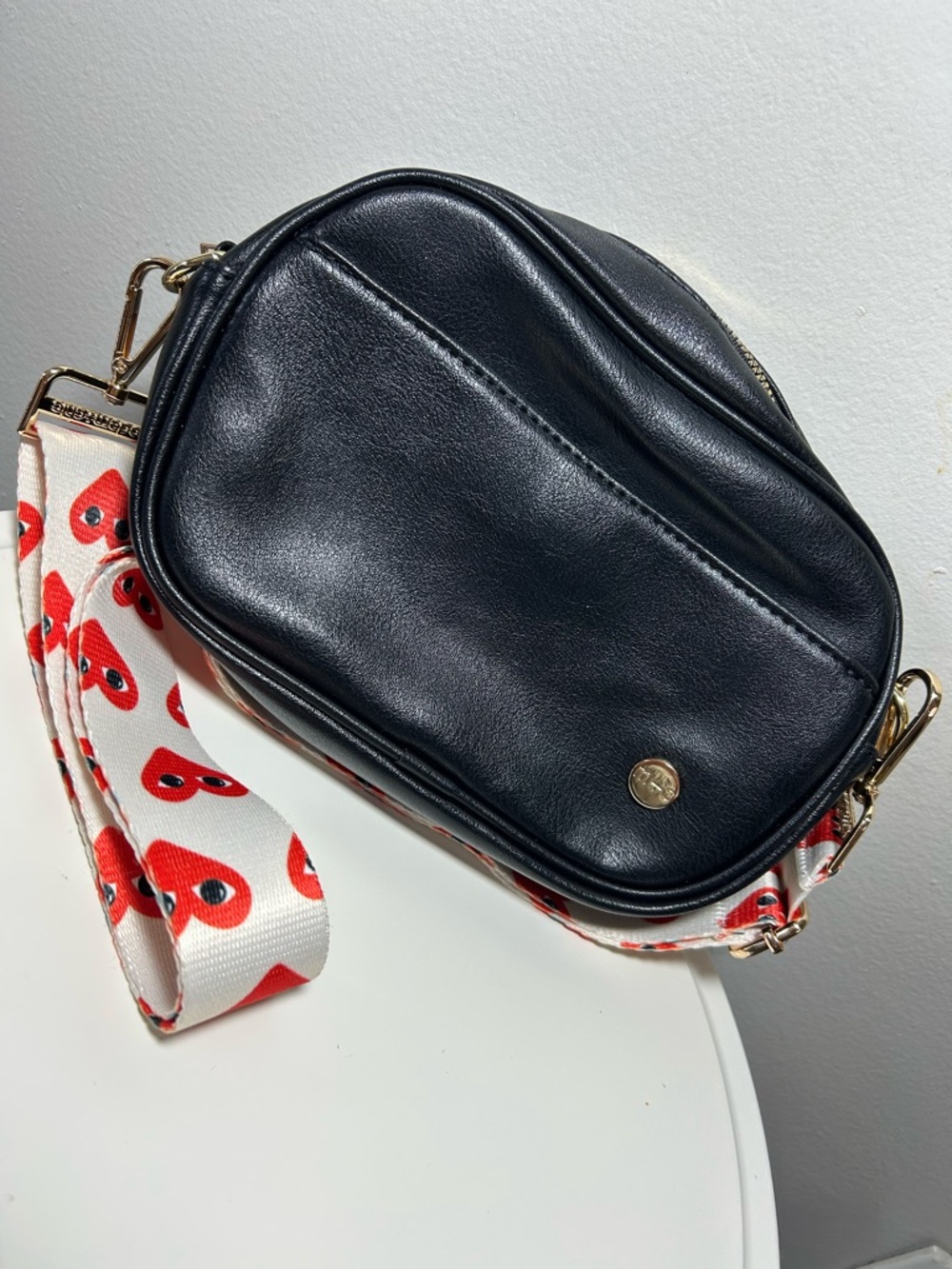 Black Crossbody Bag with Heart-Print Strap